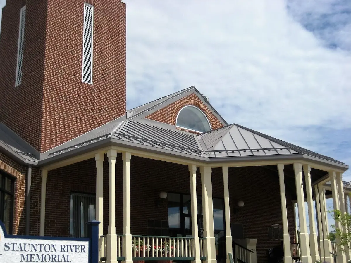 Skilled roofing craftsmen working on a residential roof in Morehead